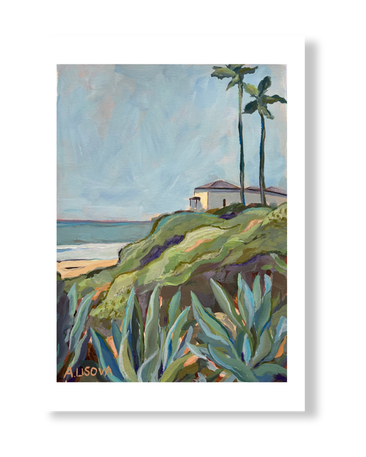 Fine art print of a coastal scene with a house, palm trees, and cacti.