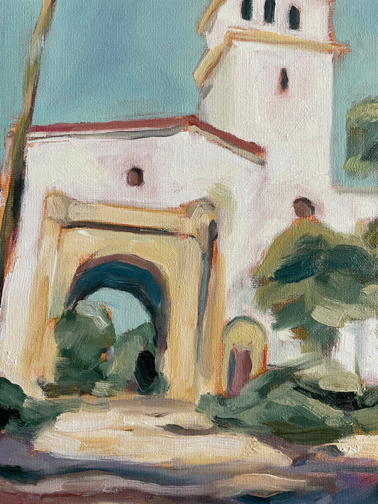 Close-up of a painting with abstract elements and a textured surface.